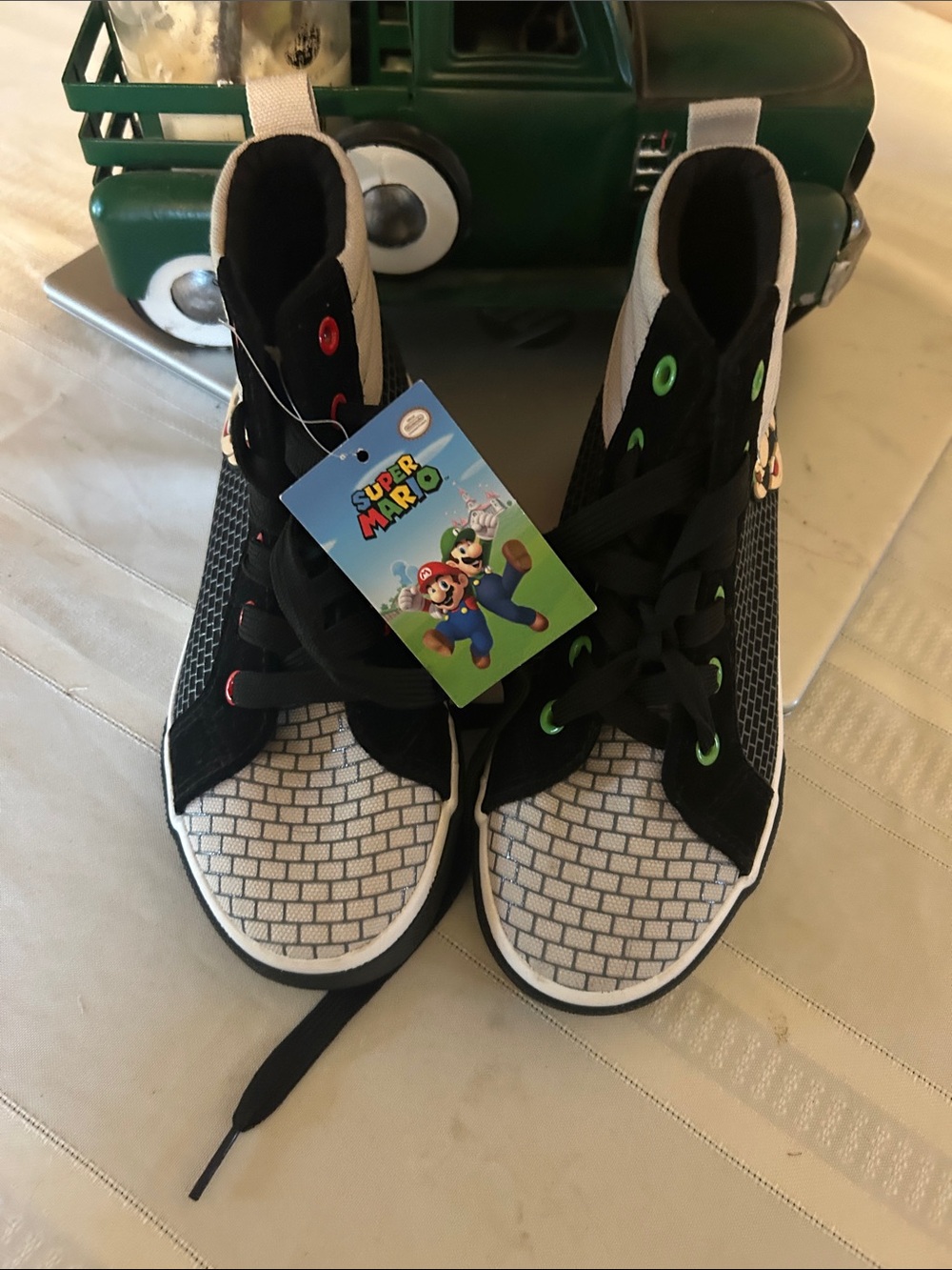 Nintendo Kids Super Mario High-Top Sneakers in Black, White and Green